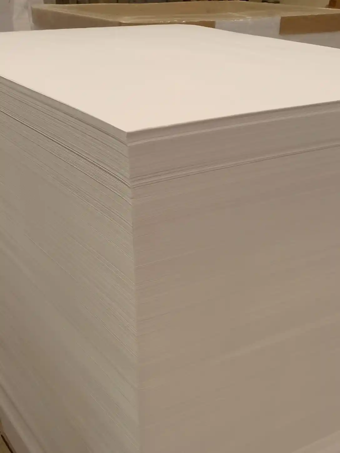 Stack of paper sheets prepared for printing during HGV Drivers Diary production.