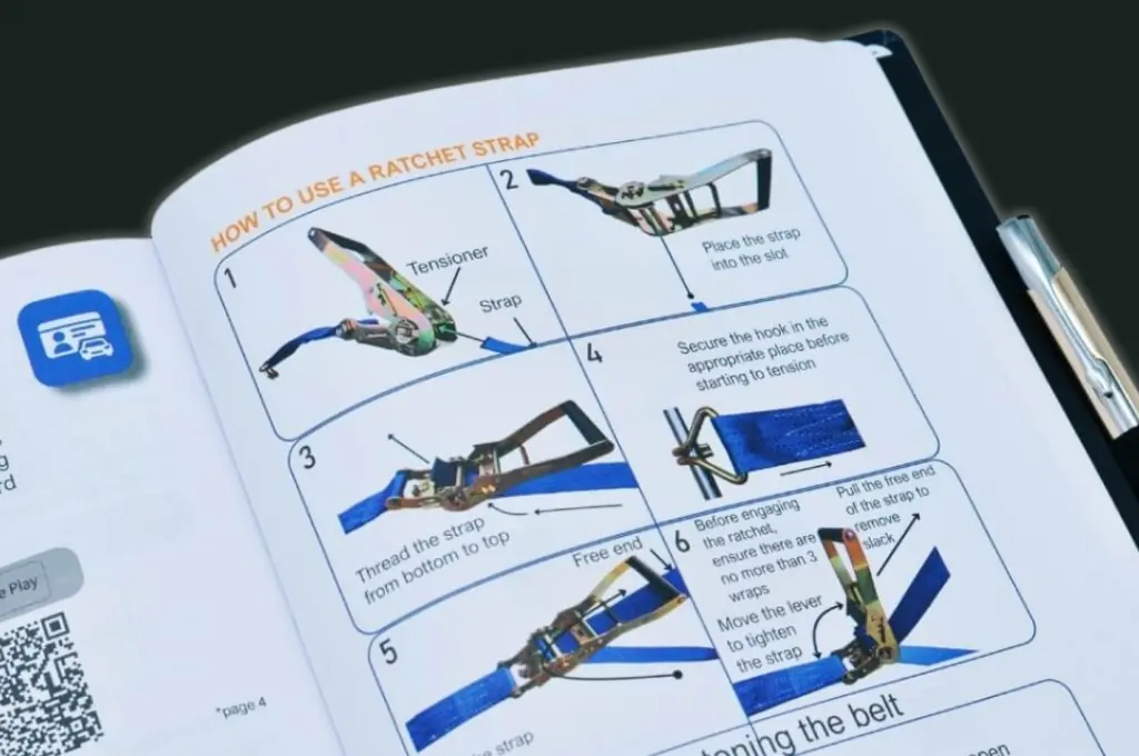 HGV Drivers Diary open at the step-by-step guide on how to use a ratchet strap