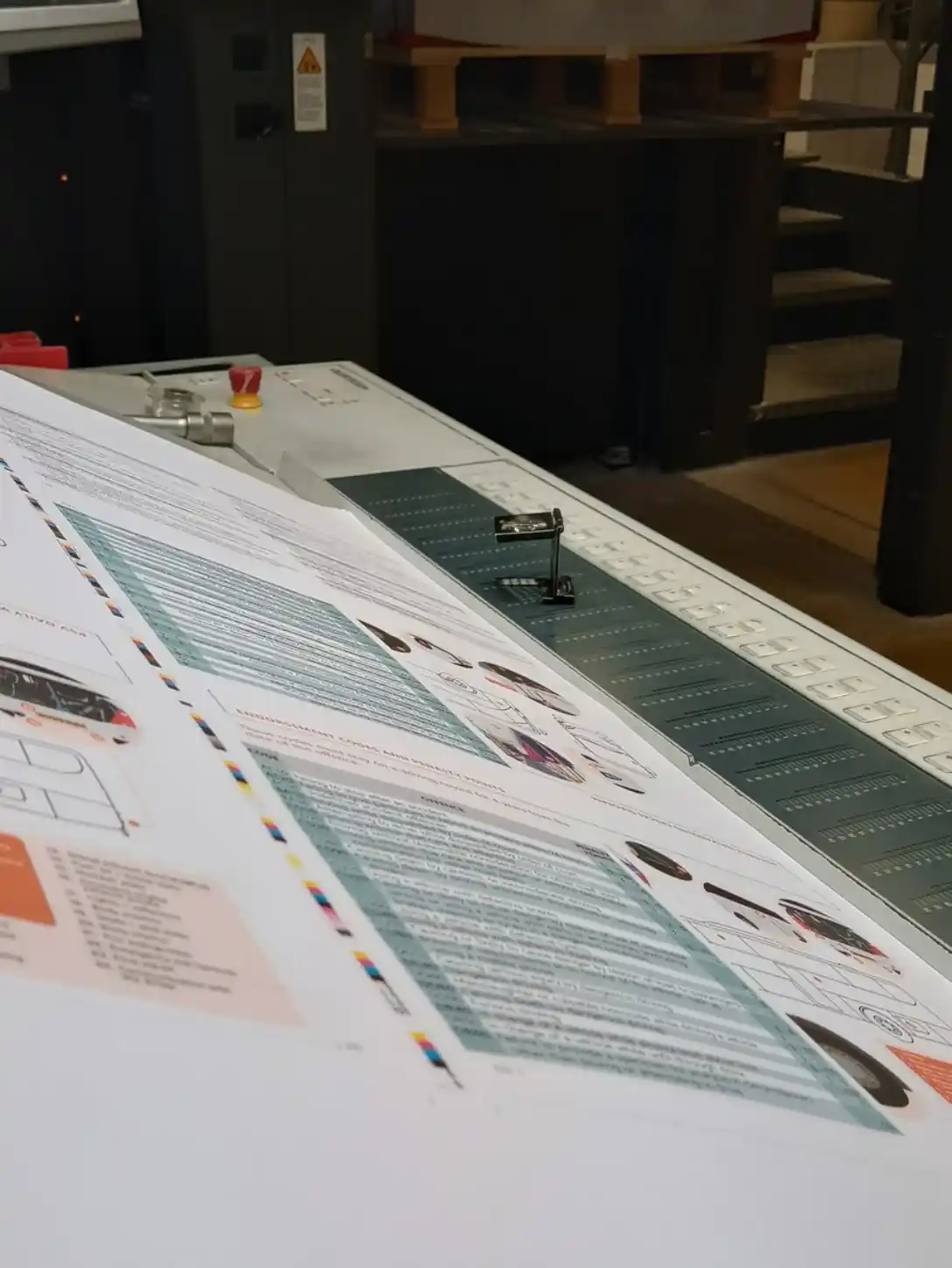 Printed HGV Drivers Diary sheets on the press during colour production.